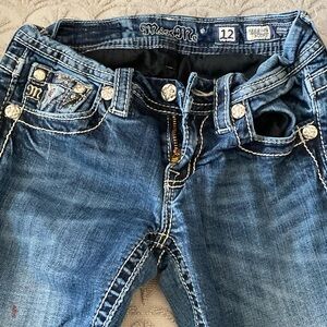 Miss Me girls jean. Lots of bling. Small red mark polish on leg